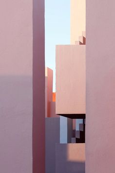 an abstract painting of pink and white buildings