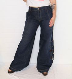 Insane Vintage 2000s Y2K 'Stuka' low rise flared phat pants raver denim jeans with chains.  In excellent vintage condition.  Size: 38 Measurements Length: 112cm Waist: 110cm Hips: 140cm Rise: 28cm Follow us on Instagram @cultofvtg Raver Jeans, Phat Pants, Jeans With Chains, Vintage 2000s, Plus Size Jeans, Jeans Pants, Low Rise, Denim Jeans, Jeans Size