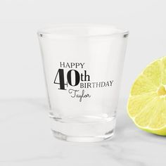 a lemon next to a shot glass that says happy 21st birthday