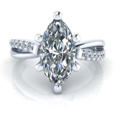 a pear shaped diamond ring with diamonds on the band and side stones in white gold