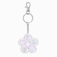 a keychain with a flower shaped design on the front and back side, hanging from