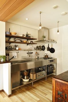 a kitchen filled with lots of pots and pans