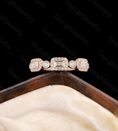 a diamond ring sitting on top of a white cloth