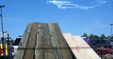 the back end of a truck with some wooden planks