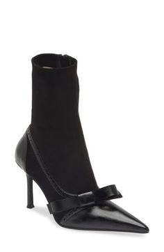 Your statement-making looks will be on lock with this almost-hybrid boot sharpened with a pointy toe, brogue trim and stiletto heel. 3 1/2" heel (size 8.5) 7 1/4" shaft (size 8.5) Synthetic upper/leather and textile lining/synthetic sole Imported Chic High Heel Boots With Contrasting Heel Counter, Chic Boots With Contrasting Heel Counter, Workwear Boots With Sculpted High Heel, Formal Fall Heeled Boots With 4-inch Heel, Winter Heels With Wrapped Heel And Pointed Toe, Black Fitted Snip Toe Heels, Fitted Snip Toe Boots For Evening, High Heel Boots With 4-inch Heel For Work, Chic Snip Toe Heels For Fall