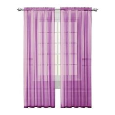 purple sheer curtains hanging on the side of a window