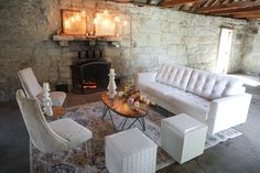 a living room filled with furniture and a fire place