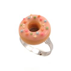 a donut shaped ring with sprinkles on it's side, sitting in front of a white background