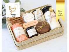 a gift box filled with personal care items and thank you note on the label next to it