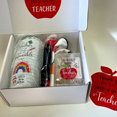 an apple box with teacher's supplies in it