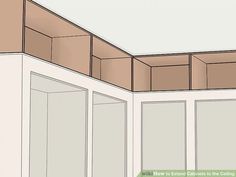 the corner of a kitchen with cabinets in it