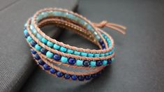 Handmade Turquoise Lapis lazuli Mixed Cryatal Woven Brass Bead Leather Bracelet Anklet S i z e : please select size S h i p p i n g : ♡ All items shipped worldwide by Thailand post. ♡ Shipped within 2- 3 days after payment received. ♡ Can be upgrade to express mail by a request before payment. You will take : ♡ 15 - 25 days after shipped from Thailand . ♡ 5- 7 days after shipped from Thailand by express mail. Blue Gemstone Beads Wrap Bracelet With Round Beads, Blue Gemstone Beads Wrap Bracelet, Turquoise Wrap Bracelet With Faceted Beads As Gift, Adjustable Blue Wrap Bracelet With Natural Stones, Wire Wrapped Blue Beaded Bracelets For Gift, Blue Wrap Bracelet With Natural Stones For Healing, Blue Beaded Bohemian Crystal Bracelet, Blue Hand Wrapped Wrap Bracelet, Blue Hand Wrapped Crystal Bracelet As Gift