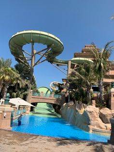 a large water slide in the middle of a swimming pool