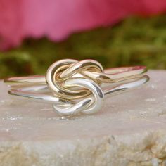 customer favorite! This double love knot ring features two interlocking knots. The two love knots can represent two people in a relationship - a couple, two friends, or family. A beautiful option for a promise ring!ColorA Silver + Rose goldB Silver +GoldC Silver + SilverD Gold+ GoldE Gold + Rose goldF Rose gold +Rose goldMaterial: 925 sterling silverColor: Silver + Rose Gold、Silver + GoldSize: US 5-10Thickness of approx 1.3mm (16 gauge for each band) Knot Promise Ring, Promise Ring Gold, Rings Pandora, Love Knots, Silver Bridesmaid, Love Knot Ring, Mode Tips, Stacker Rings, Gold Promise Rings