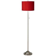 a floor lamp with a red shade on the base and a white light behind it