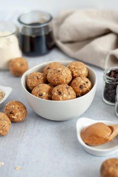 a bowl filled with oatmeal and raisins next to other ingredients