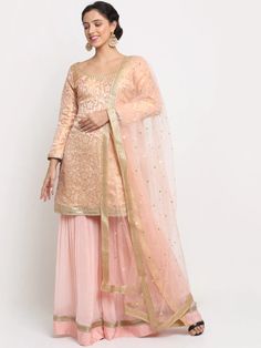 This is a beautiful 3 piece suit set. It comes with embroidered kurta has lace detailing, full sleeves, round neck, short length teamed with chinon sharara has sequin detailing with elasticated waistband and a net dupatta with sequin detailing 3 piece set Color- Peach Work- Embroidery work, Lace & Sequin Detailing Kurti Length-32 inch Kurta Fabric-Brocade Bottom Fabric-Chinon Dupatta Fabric-Net Sleeves-Full Sleeves Neck-Round Neck Care-Hand Wash or Dry Clean Straight Kurta Sets With Resham Embroidery In Chinon, Chinon Straight Kurta Sets With Resham Embroidery, Embroidered Anarkali Palazzo Set With Long Sleeves, Chinon Palazzo Set With Intricate Embroidery And Long Sleeve, Bollywood Style Sets With Resham Embroidery And Straight Kurta, Fitted Palazzo Set With Intricate Embroidery For Diwali, Eid Fitted Palazzo Set With Intricate Embroidery, Festive Embroidered Georgette Set, Festive Embroidered Long Sleeve Palazzo Set