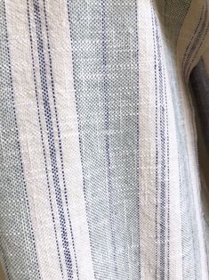 a close up view of a blue and white striped shirt