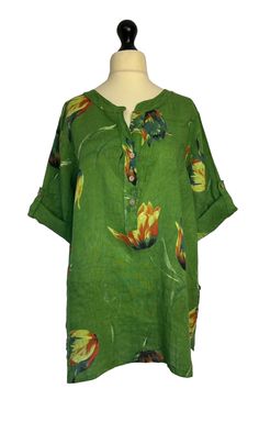 . Made from 100% linen in a pretty tulip pattern , loose fitting tunic top style with a button detail on the sides and short roll tab sleeves . One size- to fit UK sizes 14 16 18 20 . Bust measures: 50 inches . Length from back of neck to bottom hem : 29 inches . Brand new with tags Spring Linen Tops With Roll-up Sleeves, Vacation Linen Blouse With Floral Print, Casual Linen Tops With Floral Print, Short Sleeve Linen Blouse With Floral Print, Casual Linen Split Neck Tops, Green Linen Bohemian Blouse, Spring Linen Tunic With Buttons, Vacation Linen Floral Print Tops, Linen Tops With Roll-up Sleeves