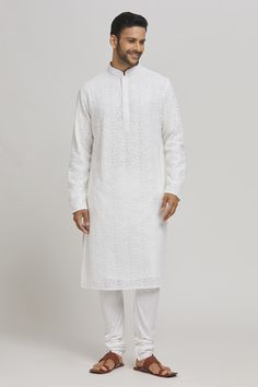 White cotton kurta with sequins and thread embroidery. Comes with churidar. - Aza Fashions Cotton Sherwani With Chikankari Embroidery For Wedding, Traditional White Kurta With Pallu, White Resham Embroidery Kurta For Ceremony, White Churidar With Floral Embroidery For Transitional Season, Festive White Kurta With Chikankari Embroidery, Bollywood Style Chikankari Embroidery Kurta, Transitional Cotton Churidar With Intricate Embroidery, White Kurta With Zari Work For Transitional Season, White Kurta With Resham Embroidery For Festivals