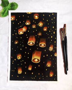 a painting with candles on it next to a pen