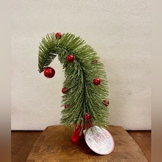 a christmas tree branch with ornaments on it