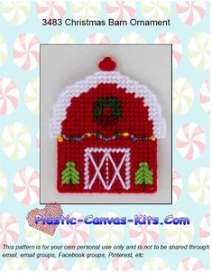 a red and white christmas barn ornament