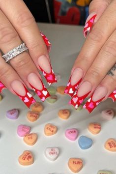 Valentine French nails are back in season and you need the best nails with unique style. Get a glimpse of our editors picks that speaks volumes.#valentinesnails/#valentinenails/valentine's day nails/valentine's day nail designs/nail ideas for valentines day Nail Art Designs For Valentines Day, Acrylic Nails For February, Matt Valentine Nails, Long Vday Nails, Valentines Nails With French Tip, Short Nail Valentines, February Nails Acrylic Coffin, Metallic Valentine Nails, Squared Valentines Nails