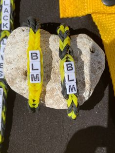 Show awareness and support for Black Lives Matter with a handmade rubber band bracelet, keychain, or backpack charm.  May be personalized, made with authentic Rainbow Loom bands, and handmade by kids that support BLM. **For every item purchased, we donate a bracelet to a Children's Miracle Network. Thank you! Key chain is 8 inches long.  Other keychain style with BLM can be made.   Alternate bracelet patterns and personalization available upon request. PS-We realize that the one "M" block is actually a "W" turned upside down, and this will not happen with your item. Rainbow Loom Rubber Bands, Rainbow Loom Bands, Keychain Backpack, Rubber Band Bracelet, Bracelet Keychain, Backpack Charm, Loom Bands, Personalized Bracelet, Rainbow Loom