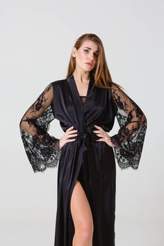 This chic silk robe is sewing from high quality fabric with luxurious soft lace sleeves. In this robe you can feel all your femininity. The robe will gently emphasize the roundness of your body. You can choose the size according to the standard size chart or order an individual size. Sleeve length - 58cm (22.8in) Short Robe length - 90cm (35 in) Long Robe length - 140cm (55 in) If you want less length - write about it in the order. The fabric is very pleasant to the body and looks great. In this Elegant Wedding Robe With Lace Cuffs, Fitted Robe With Lace Sleeves For Wedding Night, Fitted Wedding Night Robe With Lace Sleeves, Fitted Long Sleeve Lace Robe, Wedding Night Satin Robe With Lace Sleeves, Black Satin Gown With Long Sleeves, Elegant Lace Robe With Lace Cuffs, Fitted Satin Robe With Lace Trim, Fitted Lace Robe For Wedding Night