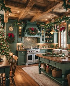 a kitchen decorated for christmas with wreaths and garland on the ceiling, green cabinets