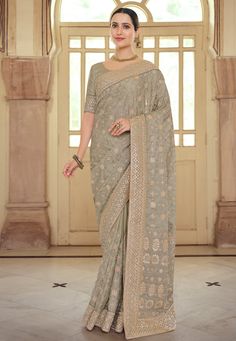 Grey satin georgette festival wear saree 7521  Desc:  Color : Grey Fabric : Satin Georgette Work : Gota   Embroidery Wash Care : Dry clean Sleeve Style : Half Sleeve Long Sleeves : Done only in Custom Stitch Sleeves Lining : Done only in Custom Stitch Bust Size : 32 to 42 Inches Occasion : Festival   Christmas   Diwali   Pongal   Lohri   Teej   Durga Pooja   Ganesh Charturthi   Onam   Vaisakhi. With Express Free Shipping and Custom Stitching, Buy Indian Wedding Party Wear Saree Grey satin george Georgette Saree Party Wear, Party Wear Sarees Online, Saree Party Wear, Resham Work, Indian Designer Sarees, Latest Designer Sarees, Party Wear Saree, Embroidered Saree, Wedding Saree Indian