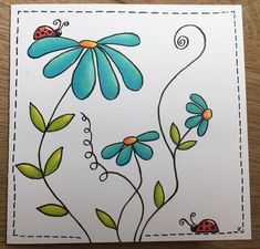 a card with flowers and ladybugs on it