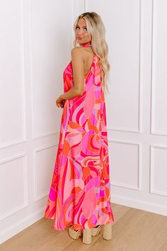 - Be as bold as you are fabulous in this vibrant maxi! Effortlessly chic with its flowy sleeveless cut, this dress is a celebration of vibrant hues. Its a perfect choice for making a statement at any occasion. Own the moment with this captivating dress! - Airy chiffon material with an abstract print featuring vibrant pinks, purples, orange, and yellow hues - A built-in lining ending above the knee - A mock neckline with back tie closure and a keyhole detail - A sleeveless cut - A relaxed silhoue Chic Flowy Maxi Dress With Vibrant Print, Pink Halter Neck Maxi Dress For Summer, Chic Halter Neck Dress With Vibrant Print, Pink Floor-length Maxi Dress For Vacation, Chic Pink Maxi Dress, Vibrant Sleeveless Maxi Dress With Vibrant Print, Vibrant Print Sundress Maxi Dress For Party, Summer Halter Neck Maxi Dress With Vibrant Print, Vibrant Multicolor Sleeveless Maxi Dress