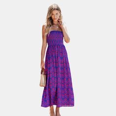 Embrace free-spirited style with our Smocked Bodice Maxi Tube Dress. This enchanting piece features a smocked bodice that hugs your curves comfortably, extending into a flowing maxi-length skirt. Whether you're attending a glamorous event or simply enjoying a casual day out, this dress will keep you feeling confident, stylish, and perfectly in tune with the vibrant energy of the season. Product code: CAA05A4E131WD Bohemian Smocked Top For The Beach, Flowy Bohemian Smocked Top, Summer Purple Smocked Top With Smocked Bodice, Purple Smocked Top With Smocked Bodice For Summer, Blue Bohemian Smocked Top, Spring Purple Smocked Top, Bohemian Smocked Sleeveless Beach Top, Bohemian Smocked Sleeveless Top For Beach, Bohemian Sleeveless Smocked Top For Beach