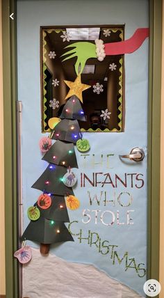 a door decorated with christmas decorations and the words, the inflants who stole christmas