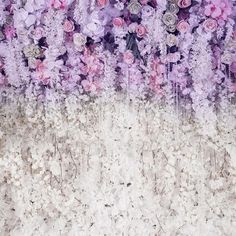 an abstract painting with flowers in the middle and purple on the bottom, along with white background