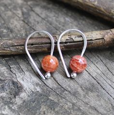 Sunstone sterling silver earrings Sterling silver budded open hoops with 6mm shimmering orange sunstone. 👉 The stones are natural ~ variations from the pictures will occur. Open hoops are applied to your ears by grasping the open ends in each hand and gently pulling one end up and one end down, then simply slide them in your ear. DO NOT pry them open then pinch them closed, they will lose shape and not close properly Orange Gemstone Sterling Silver Earrings, Minimalist Orange Earrings For Everyday, Orange Minimalist Earrings For Everyday, Everyday Minimalist Orange Earrings, Nickel Free Orange Earrings For Everyday, Nickel-free Orange Earrings For Everyday Wear, Handmade Minimalist Orange Earrings, Minimalist Handmade Orange Earrings, Minimalist Orange Drop Earrings