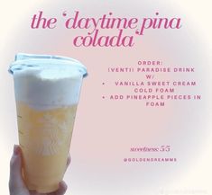 a hand holding up a drink in front of a pink and white background with the words, the daytime pina cola