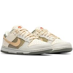 Blending leather, cotton, and suede, Nike's latest Women's Dunk Low comes in a Coconut Milk, Sesame, and Alabaster colorway that is mellow like a spring breeze, ready to add a versatile layer to any outfit. Closed out with hemp lacing and secondary heel Swooshes.  NIKE DUNK LOW COCONT MLK/SESME-ALBSTR-BNE FZ4341-100 Cream Nike Sneakers, Beige Cotton Sneakers For Spring, Spring Cream Cotton Sneakers, Cream Sneakers For Fall, Spring Breeze, Nike Dunk Low, Dunk Low, Nike Dunk, Low Lights