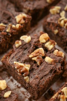 some brownies with nuts on top of them