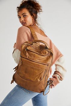 Carry it all in this classically cool leather backpack featured in a slouchy design with exposed zipper pockets and a cracked, distressed finish.* Adjustable straps* Lined interior* Multiple compartments Backpacks Leather Women, Women’s Backpacks, Women’s Backpack, Work Backpack Women, Teacher Backpack, Leather Backpacks For Women, Outfits With Purses, Leather Book Bag, Backpack Purses