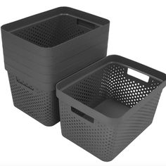 two black plastic storage baskets with holes on the front and back, one is empty