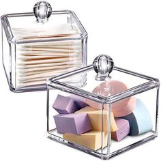 two clear boxes filled with different colored soaps