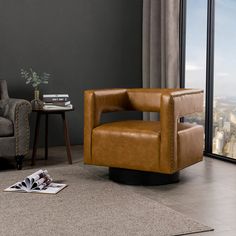 a brown leather chair sitting in front of a window next to a table with a magazine on it