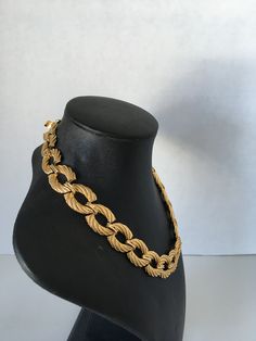 This is a gorgeous gold tone rope link vintage necklace featuring a choker length, a curb chain, a two-part push clasp (box clasp) closure with minimal signs of wear. Please note that vintage items are not new and therefore might have minor imperfections. Designer Style The necklace measures approximately 16 inches and 3/4 inches wide. In excellent condition. Prices are listed for Canada and USA only but if you wish to have them shipped elsewhere, please message me the shipping address and I wil Vintage Gold-tone Oval Link Necklace, Vintage Chain Choker Necklace, Vintage Choker Chain Necklace, Formal Rope Chain Necklace, Vintage Yellow Gold Chain Link Necklace, Vintage Yellow Gold Curb Chain Necklace, Vintage Gold Chain Link Jewelry, Vintage Oval Link Chain Necklace For Formal Occasions, Vintage Curb Chain Necklace With Oval Links