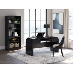 a desk with a laptop on it in front of a bookcase and chair next to a window