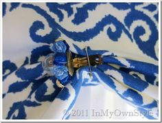 blue and white fabric with scissors on it