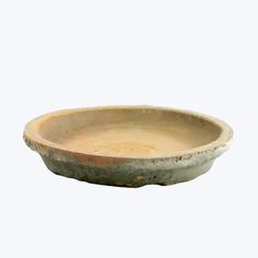 an old bowl is shown on a white background