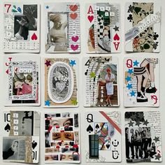 many different playing cards are arranged on a white surface with black and red accents, including one in the middle